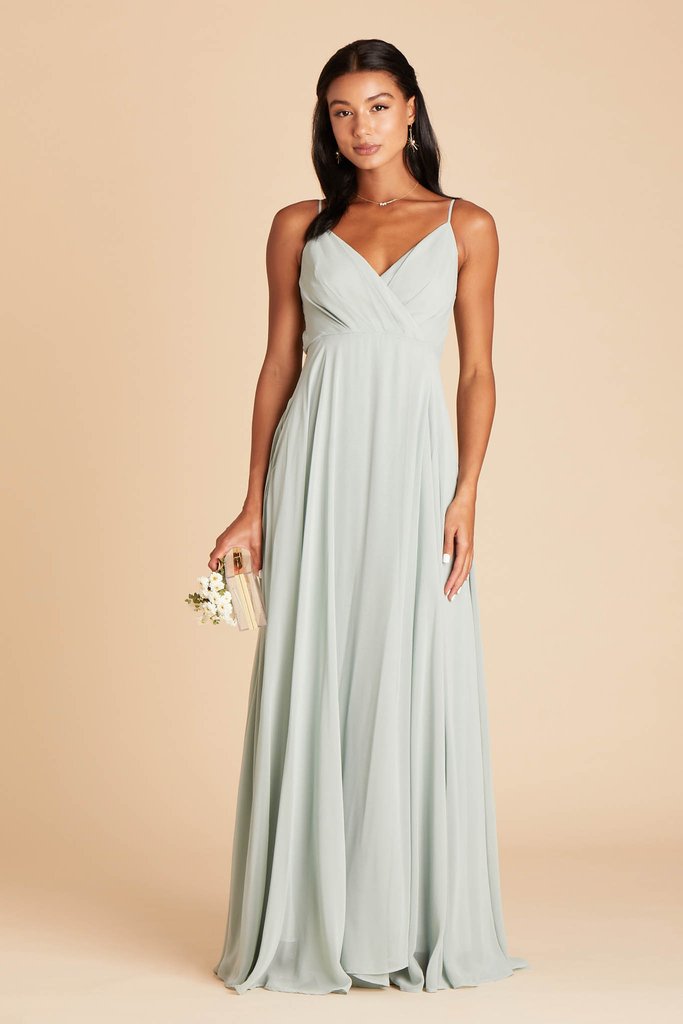 Front view of the Kira Dress in sage chiffon worn by a slender model with a medium skin tone. 