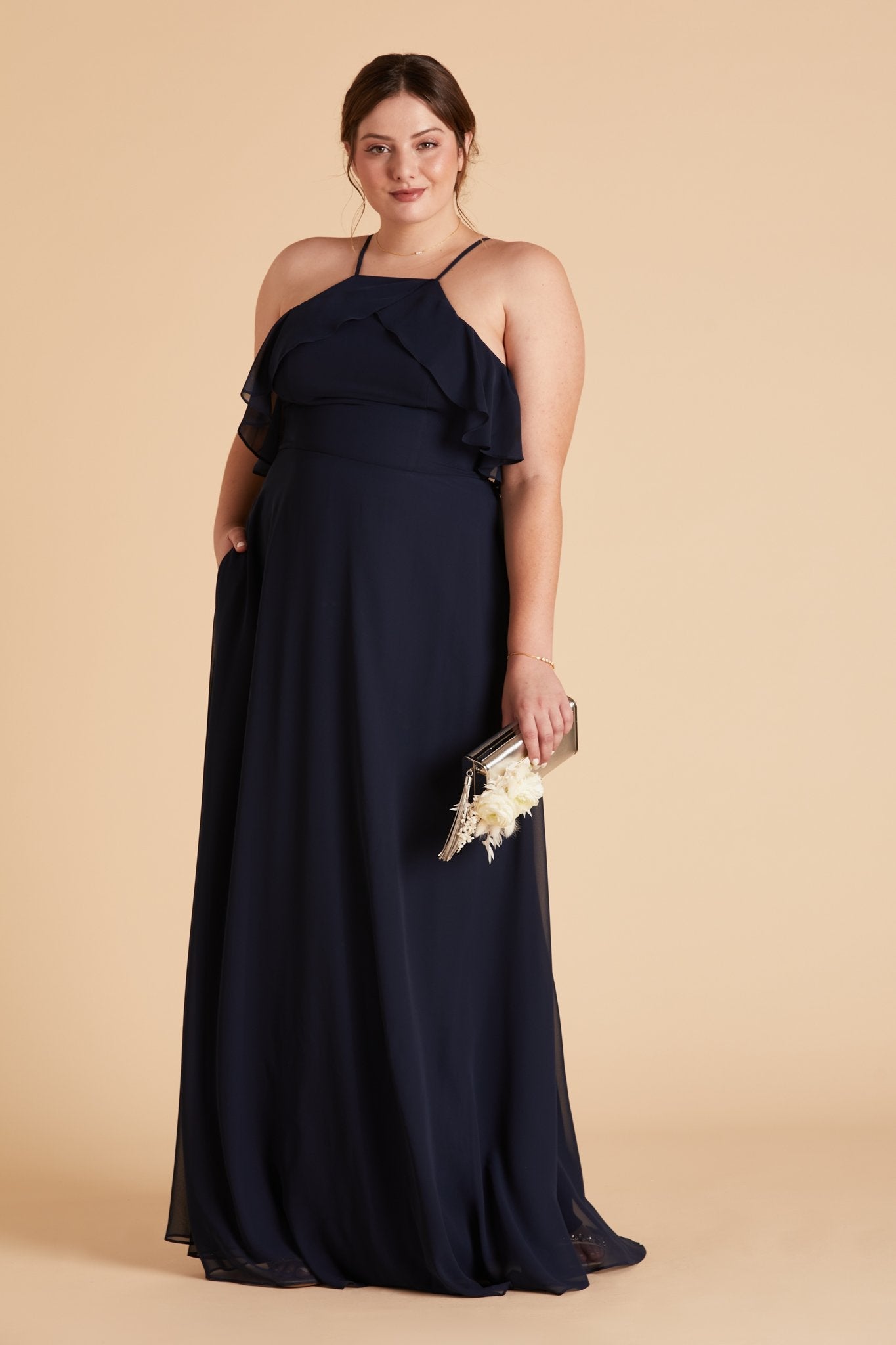 Jules plus size bridesmaid dress in navy blue chiffon by Birdy Grey, side view with hand in pocket