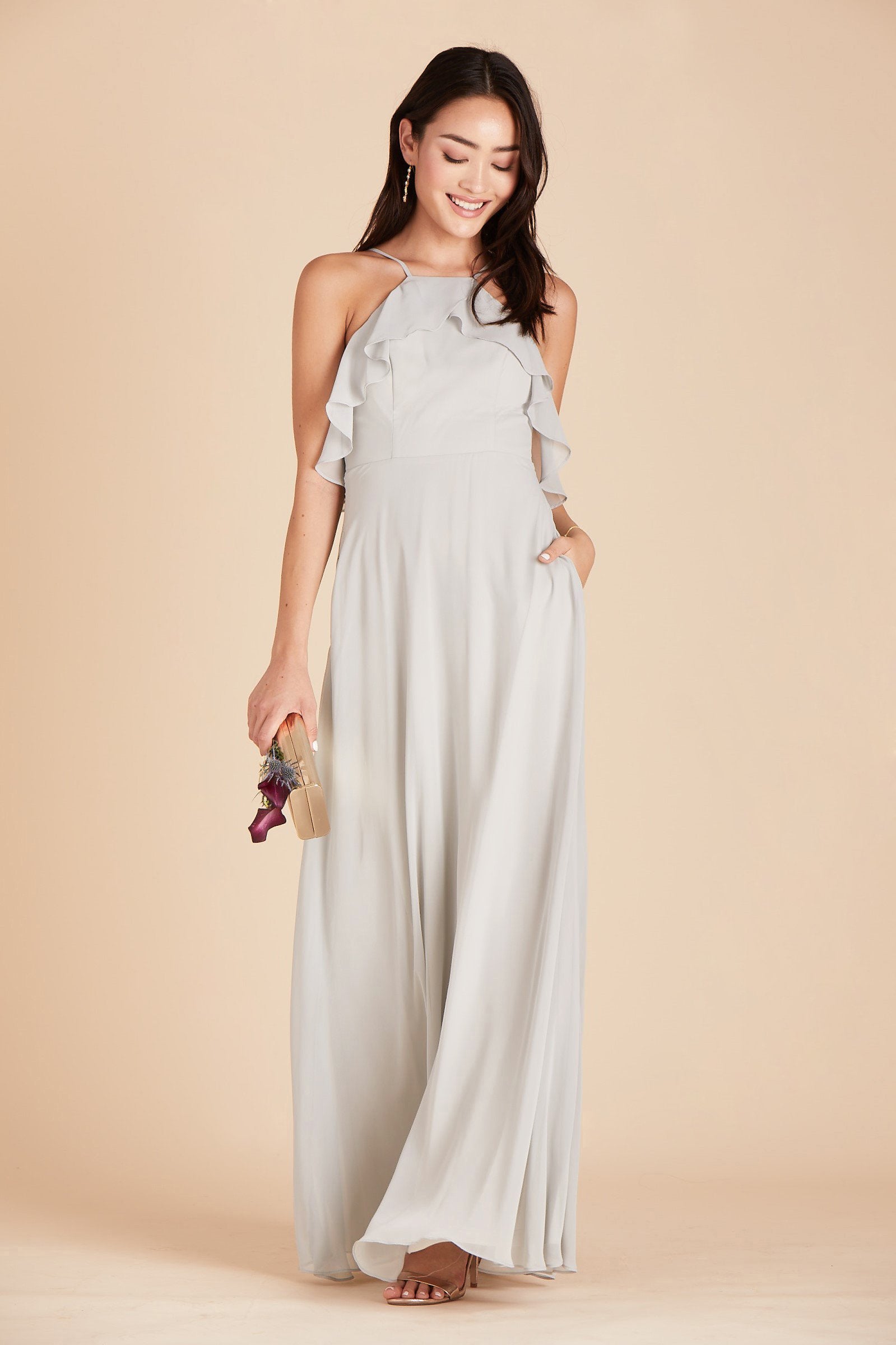 Jules bridesmaid dress in dove gray chiffon by Birdy Grey, front view with hand in pocket