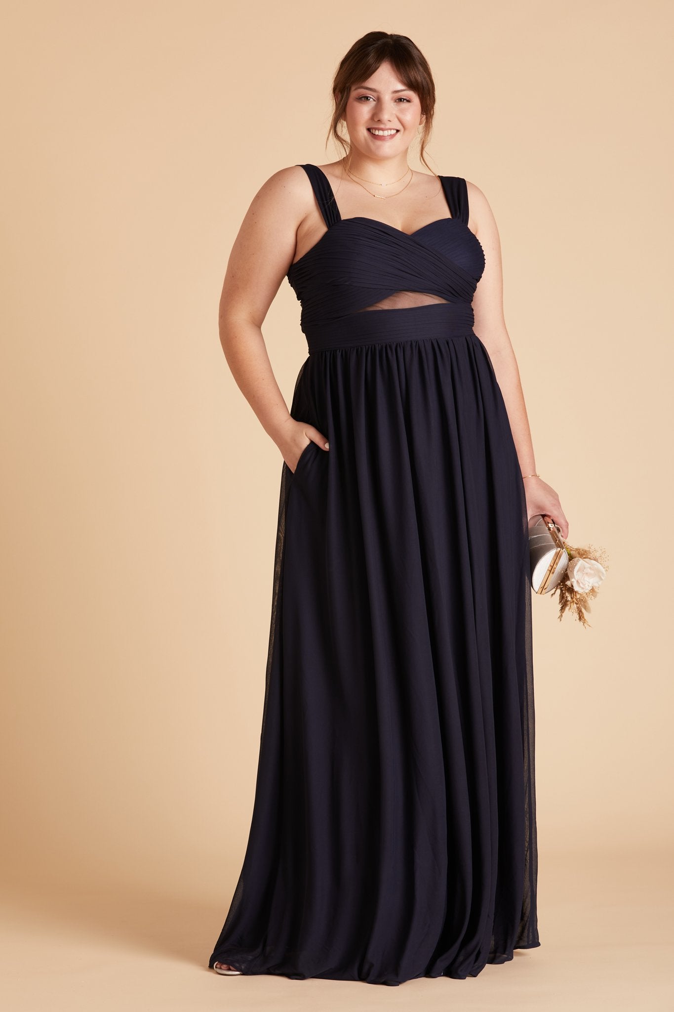 Elsye plus size bridesmaid dress in navy blue chiffon by Birdy Grey, front view with hand in pocket