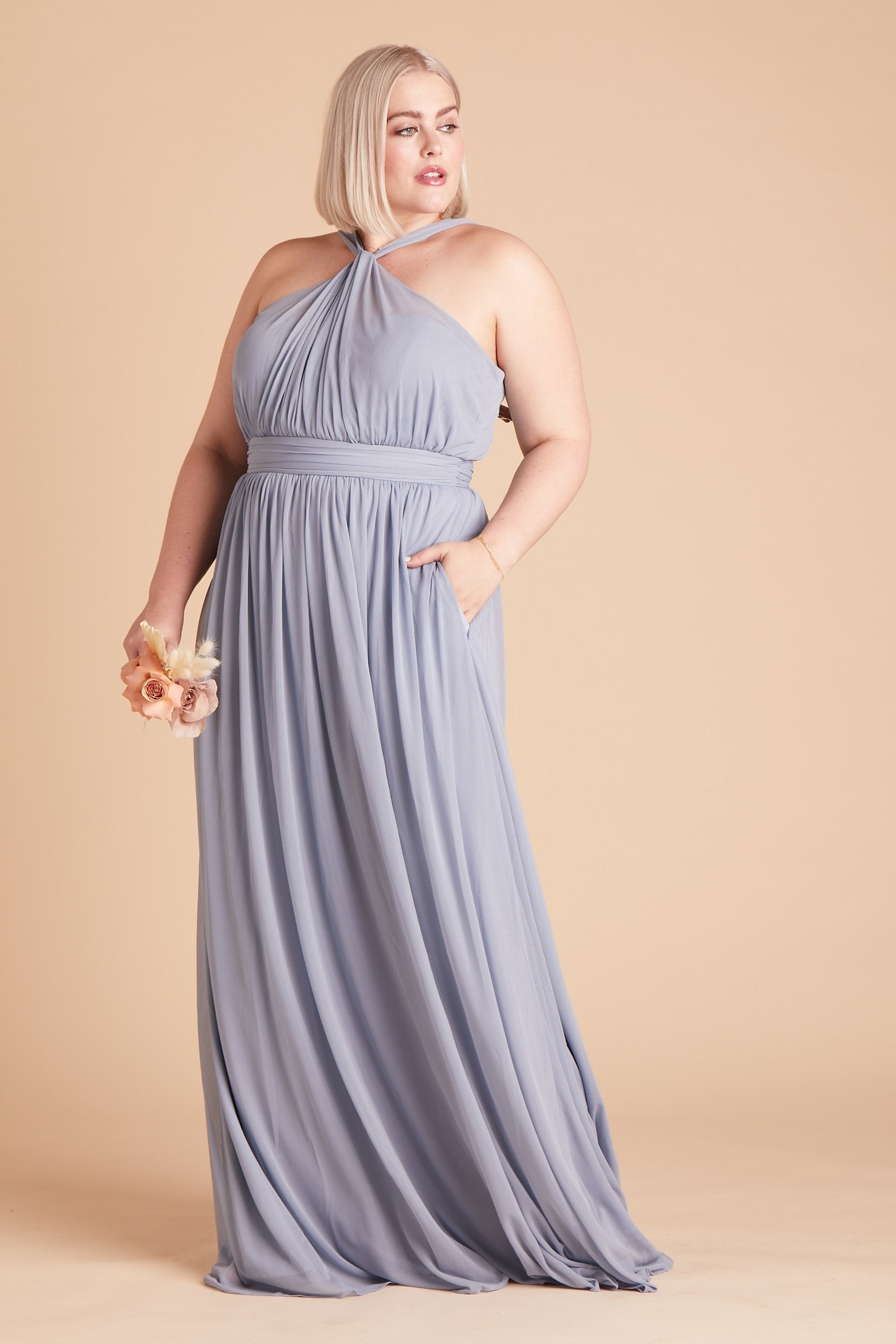 Kiko plus size bridesmaid dress in dusty blue chiffon by Birdy Grey, front view with hand in pocket