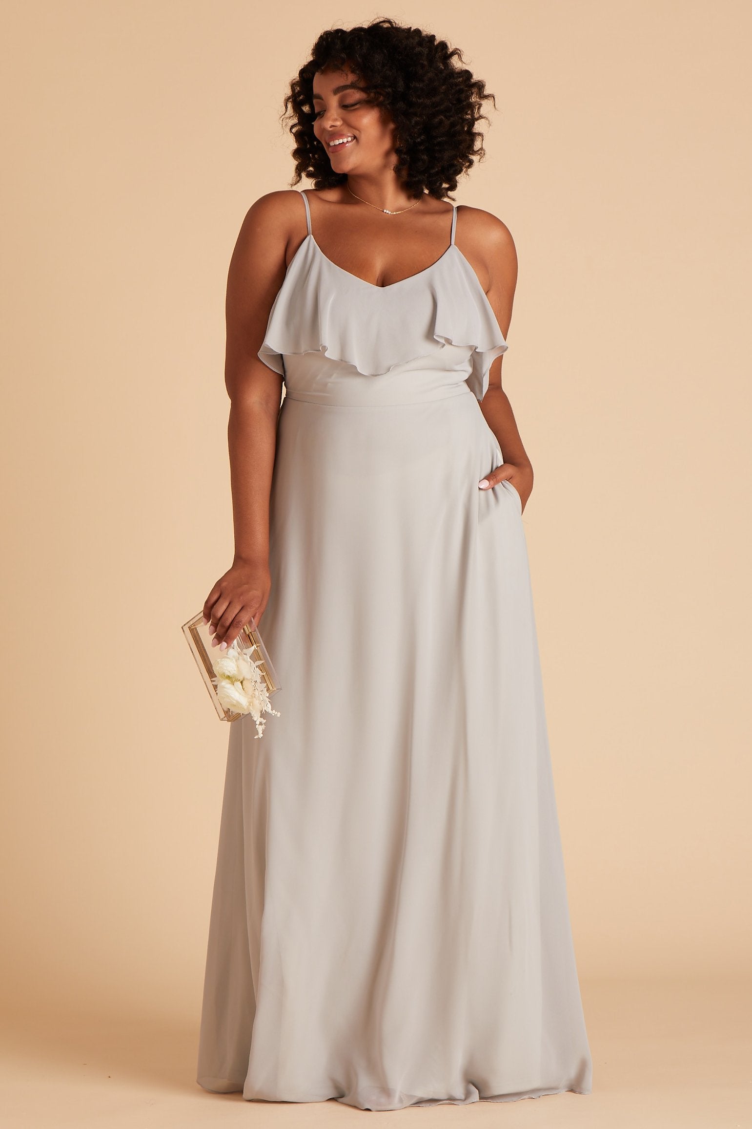 Jane convertible plus size bridesmaid dress in dove gray chiffon by Birdy Grey, front view with hand in pocket