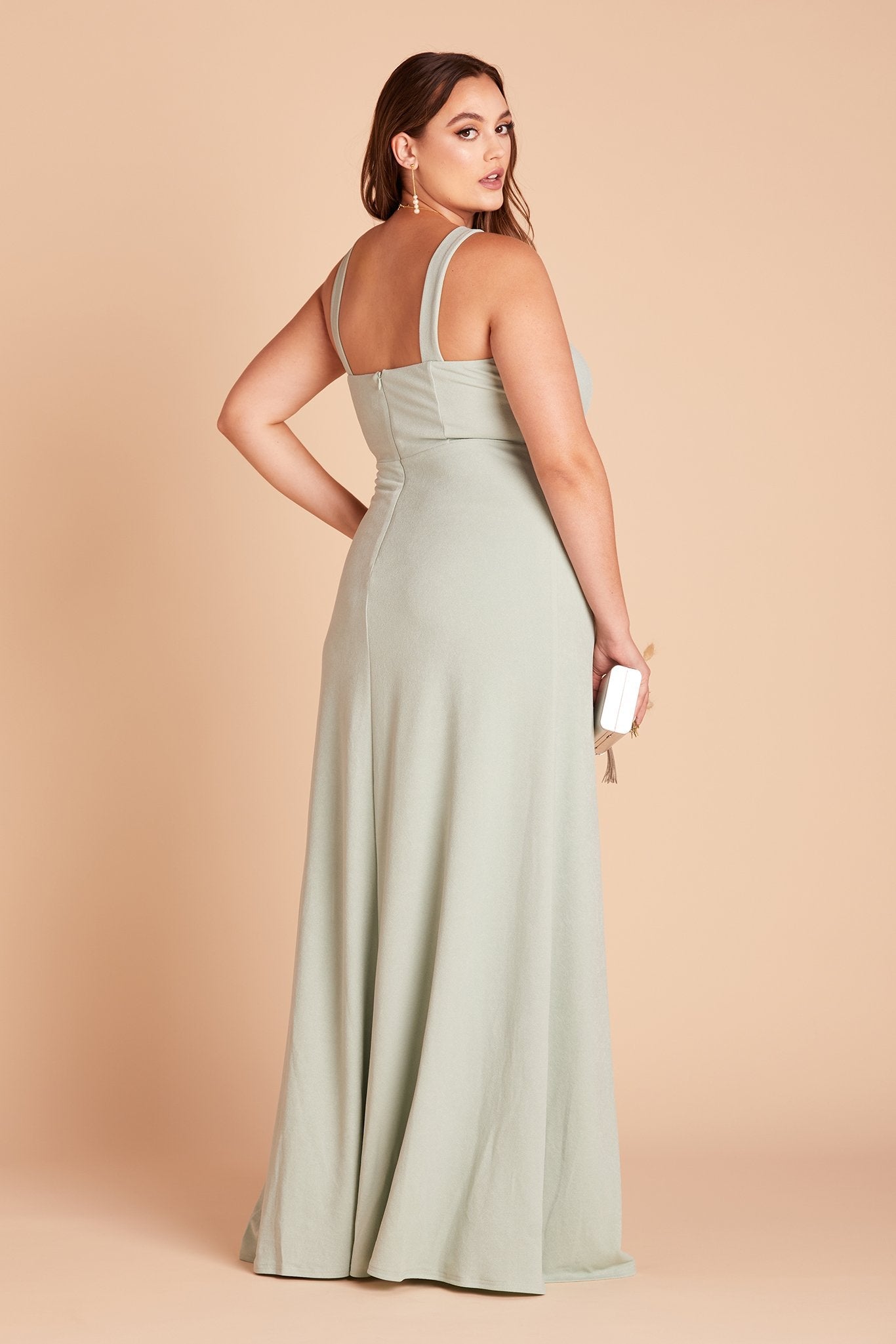 Gene plus size bridesmaid dress with slit in sage green crepe by Birdy Grey, side view