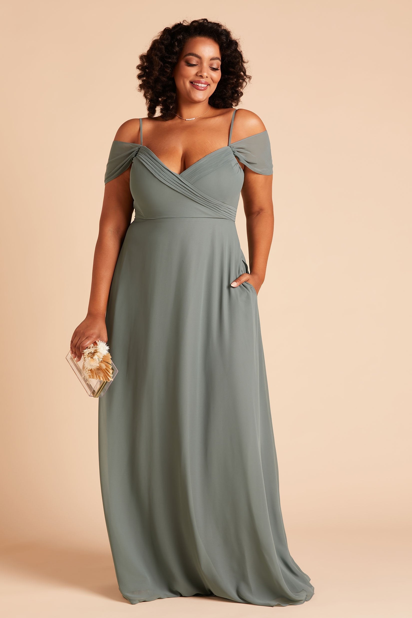 Spence convertible plus size bridesmaid dress in sea glass green chiffon by Birdy Grey, front view with hand in pocket