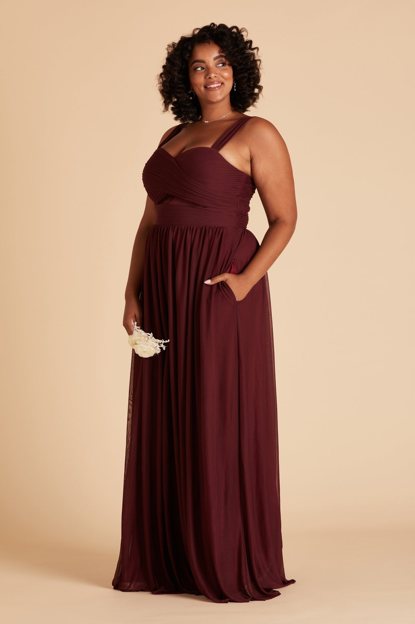 Elsye plus size bridesmaid dress in cabernet burgundy chiffon by Birdy Grey, side view with hand in pocket