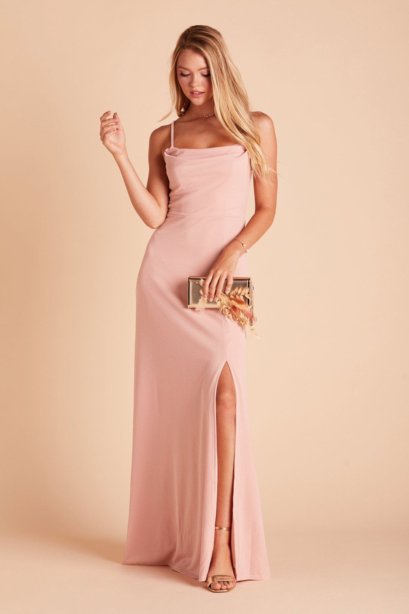Front view of a model wearing Ash Bridesmaid Dress in dusty rose crepe with a Natalie Chunky Heel shoe in gold. 