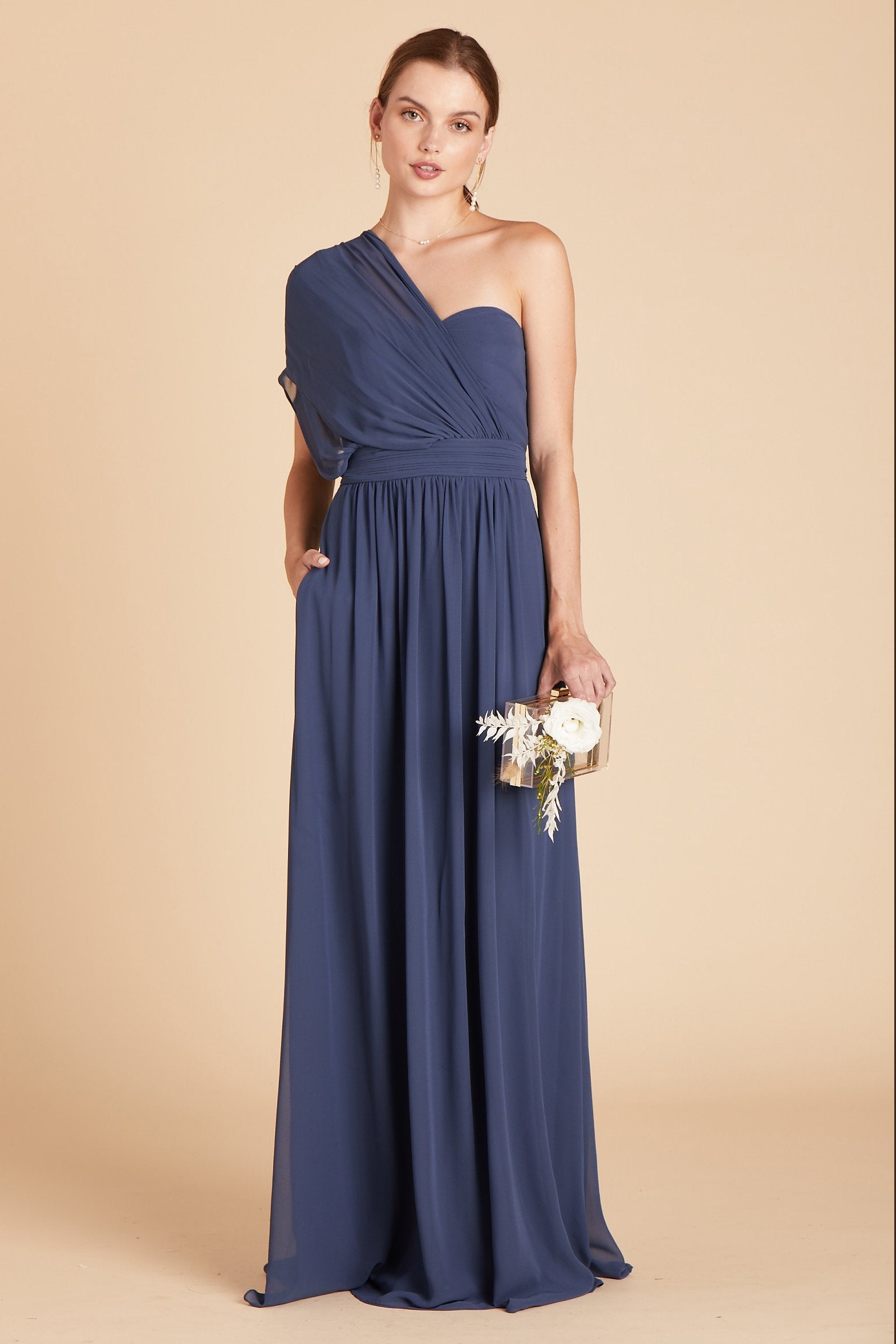 Grace convertible bridesmaid dress in slate blue chiffon by Birdy Grey, front view with hand in pocket