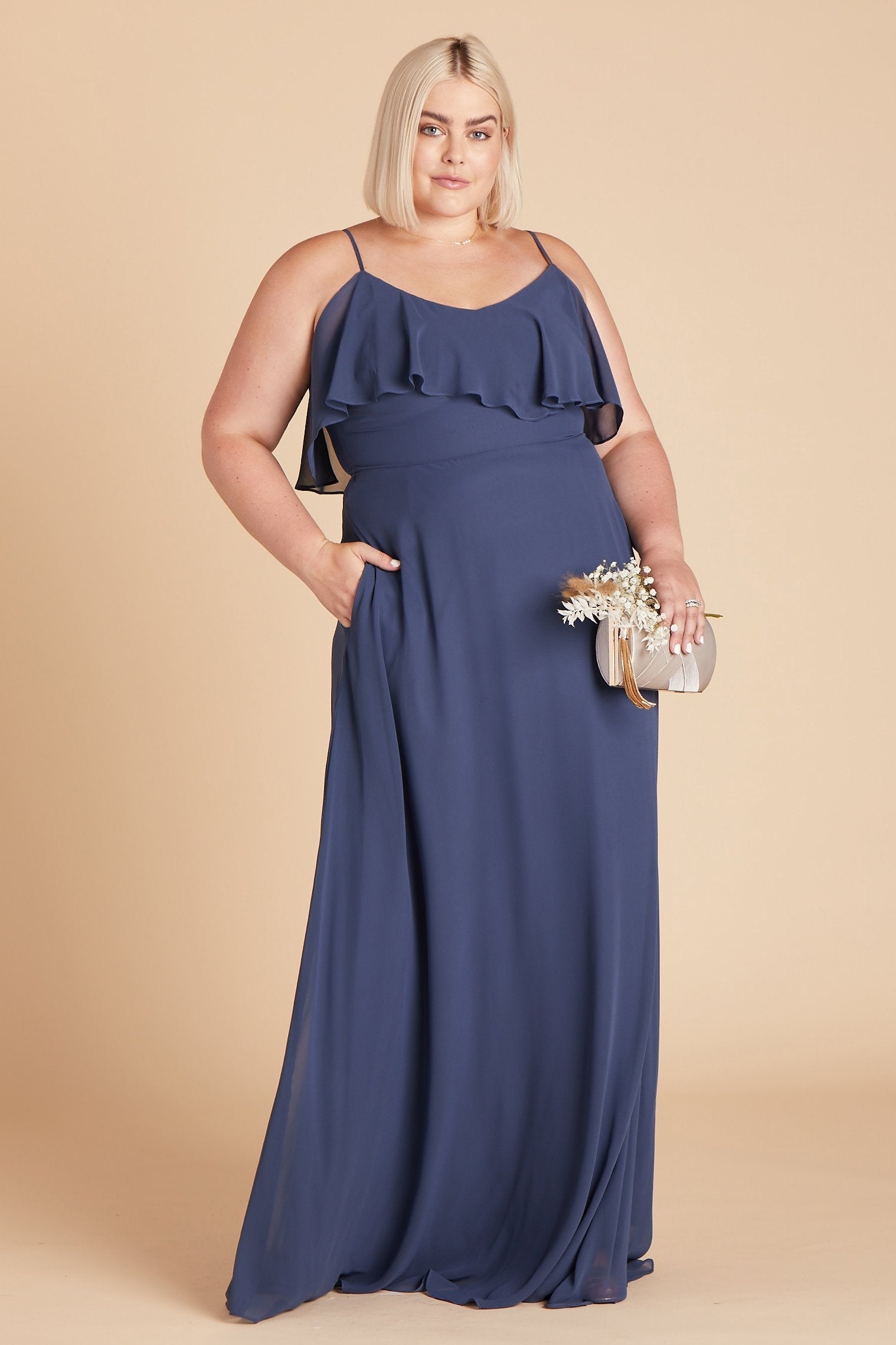 Jane convertible plus size bridesmaid dress in slate blue chiffon by Birdy Grey, front view with hand in pocket