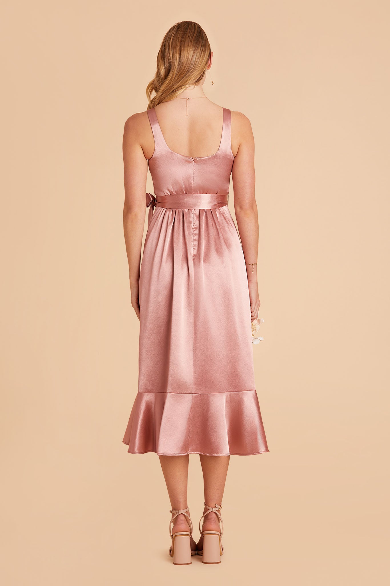 Pink satin convertible pinafore-style midi bridesmaid dress with ruffles