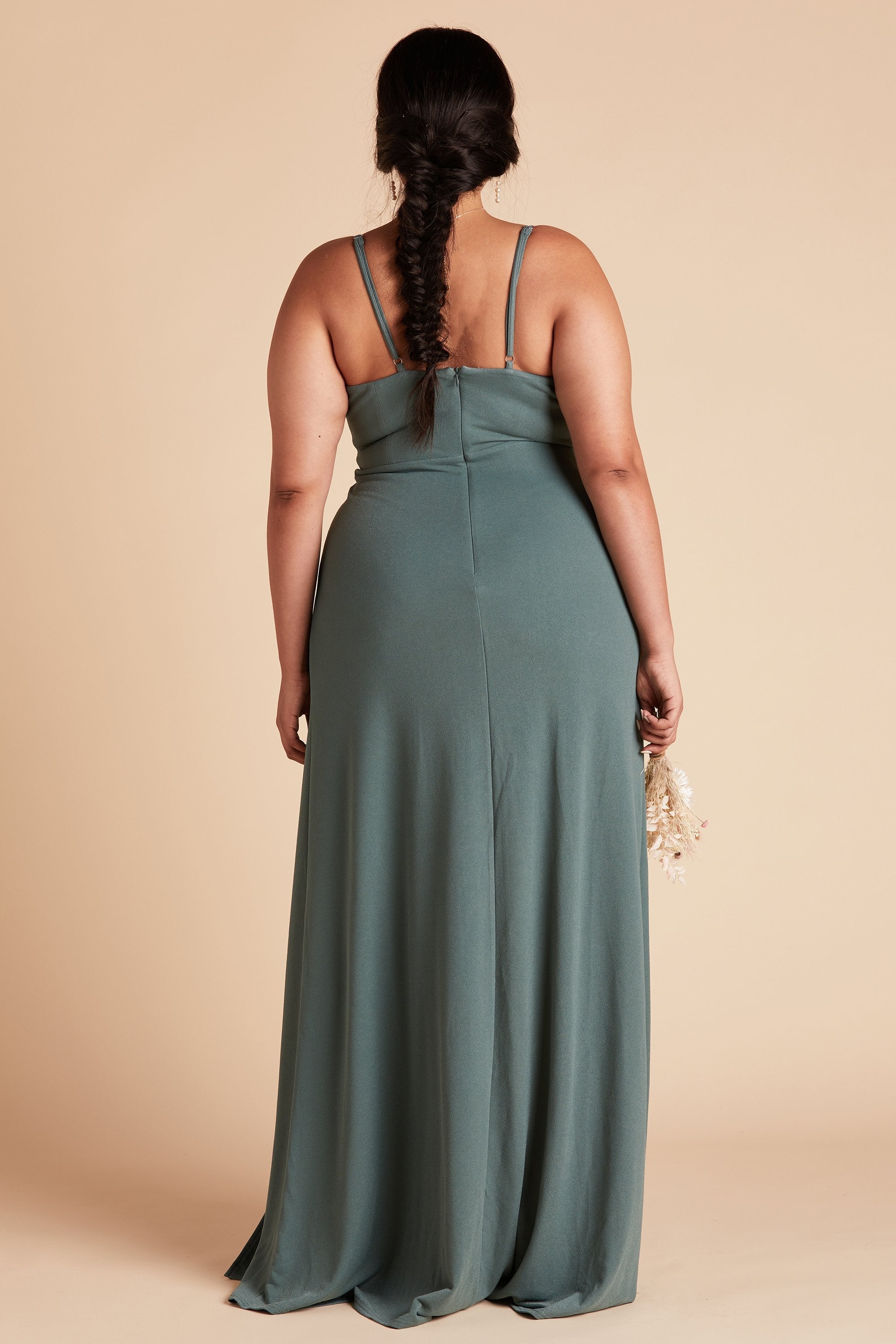 Back view of the Ash Plus Size Bridesmaid Dress in sea glass crepe shows skinny adjustable straps as well as an open back just below shoulder blades.