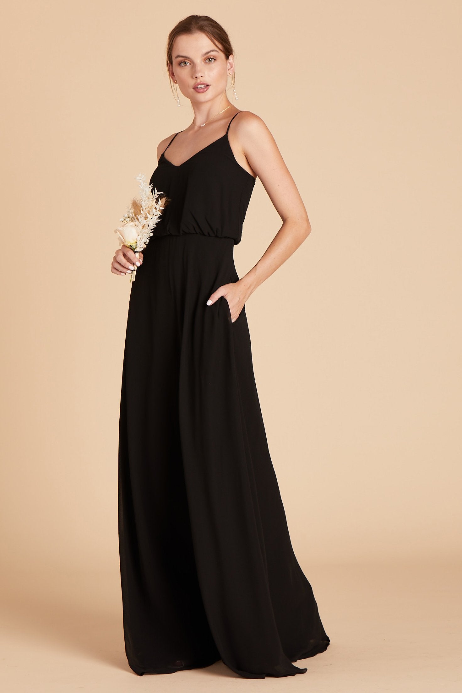 Gwennie bridesmaid dress in black chiffon by Birdy Grey, front view with hand in pocket