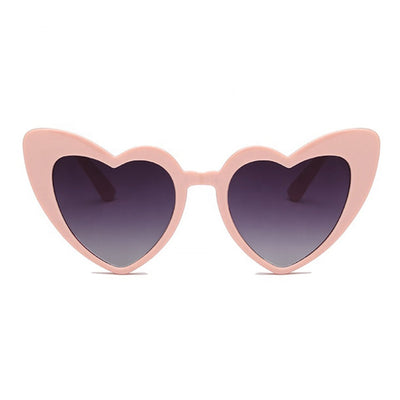 Heart sunglasses in pink with dark lenses by Birdy Grey, front view