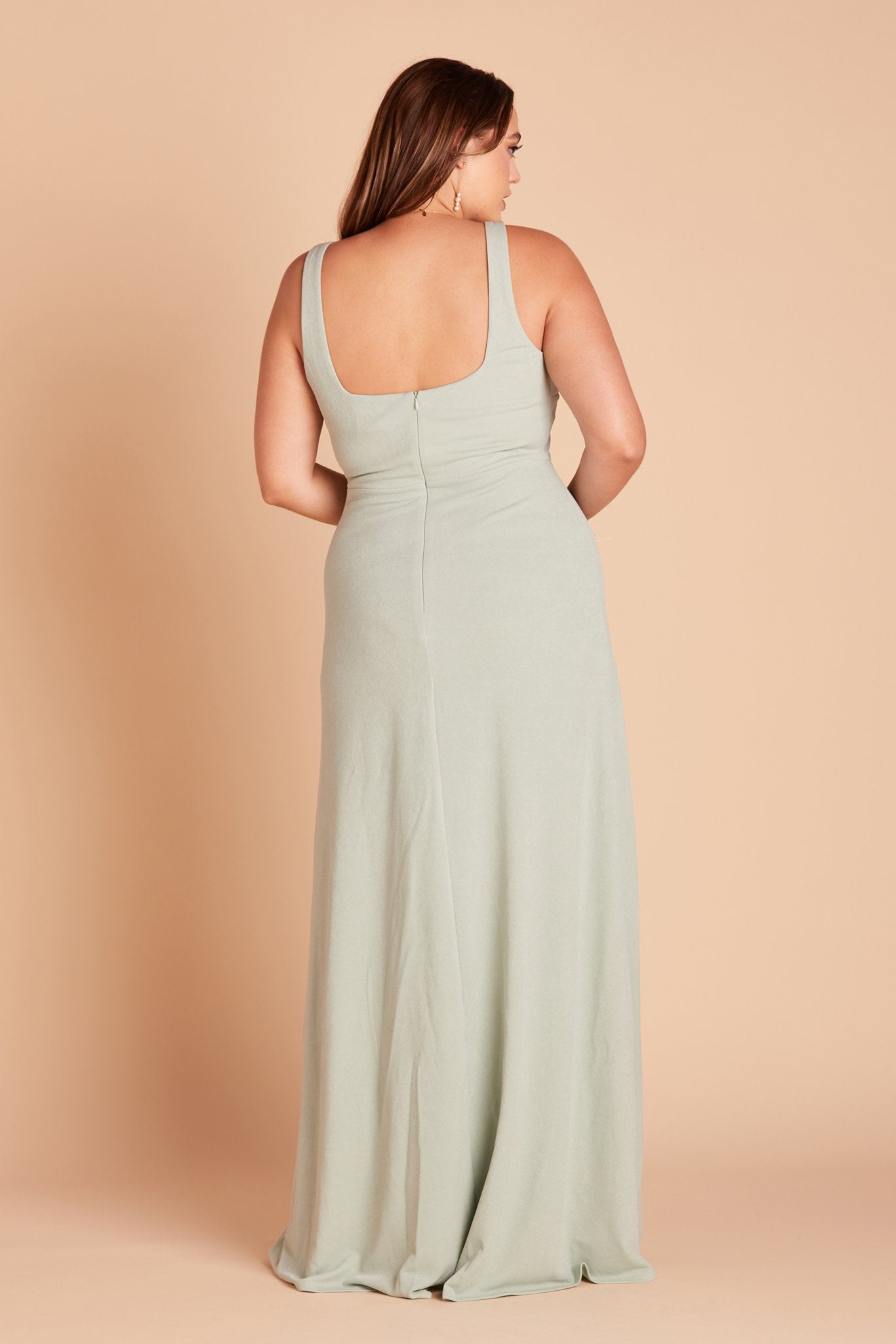 Back view of the Alex Convertible Plus Size Bridesmaid Dress in sage green crepe without shoulder ties features a square cut that falls just below the shoulder blades.