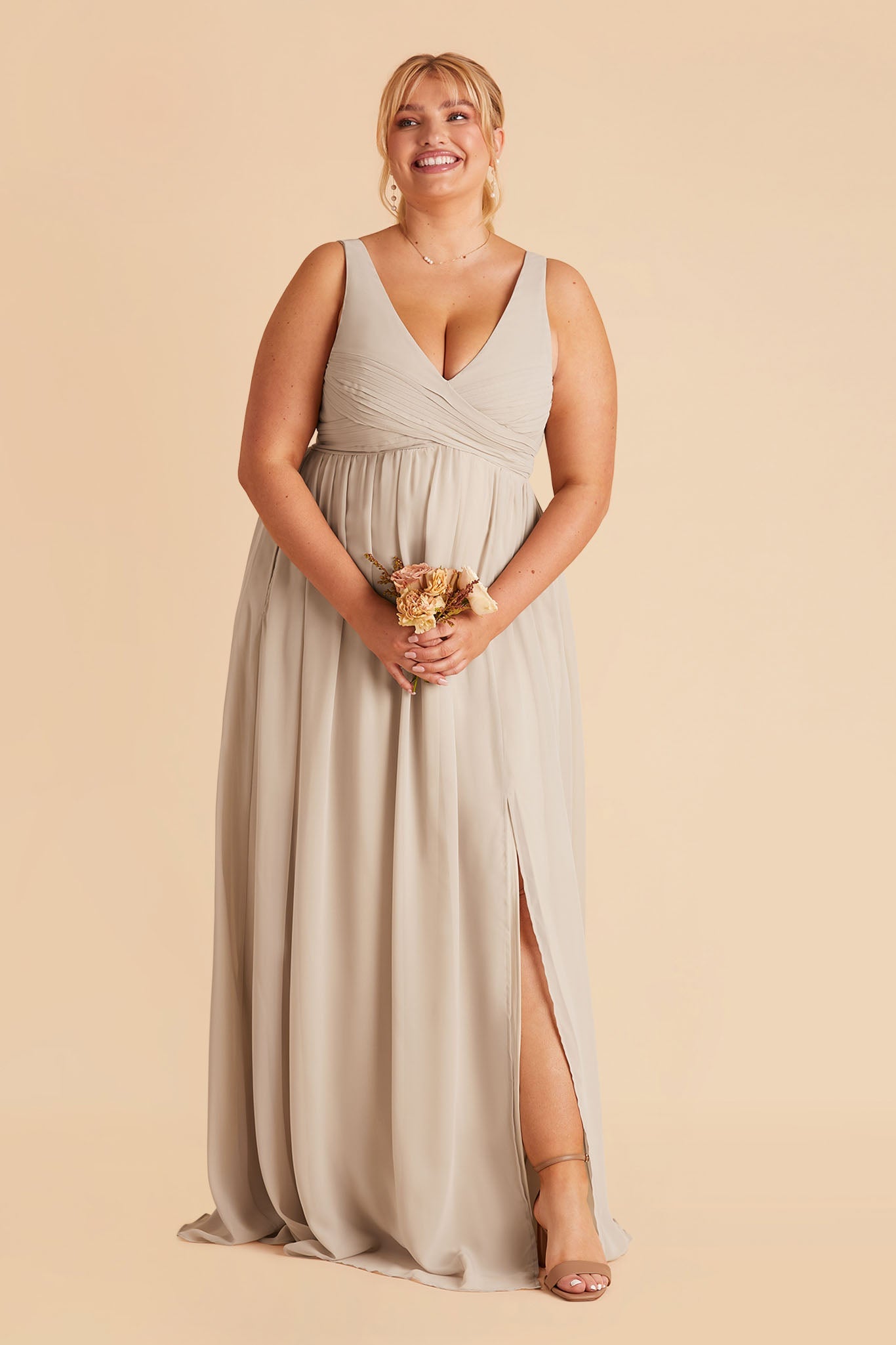 Laurie Empire plus size maternity bridesmaid dress with slit in neutral champagne by Birdy Grey, front view
