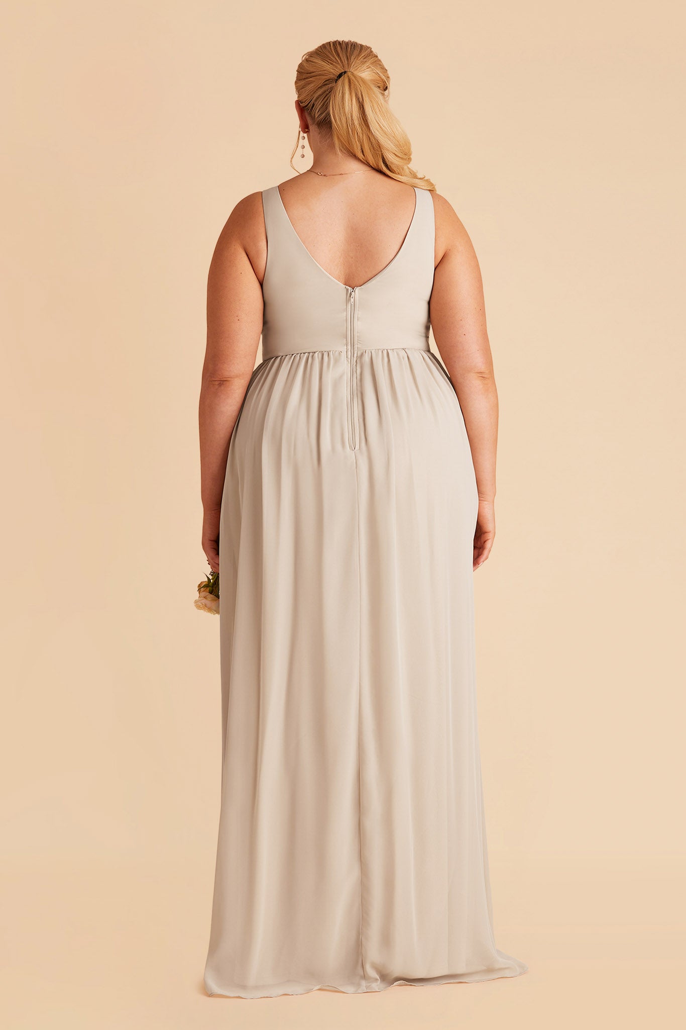 Laurie Empire plus size maternity bridesmaid dress with slit in neutral champagne by Birdy Grey, back view