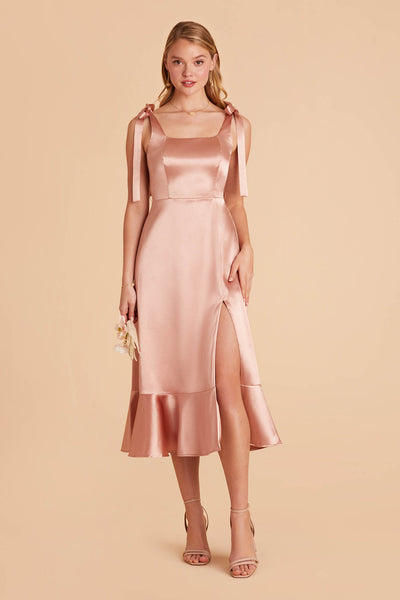 rose gold pink satin convertible pinafore-style midi bridesmaid dress with bows and ruffles