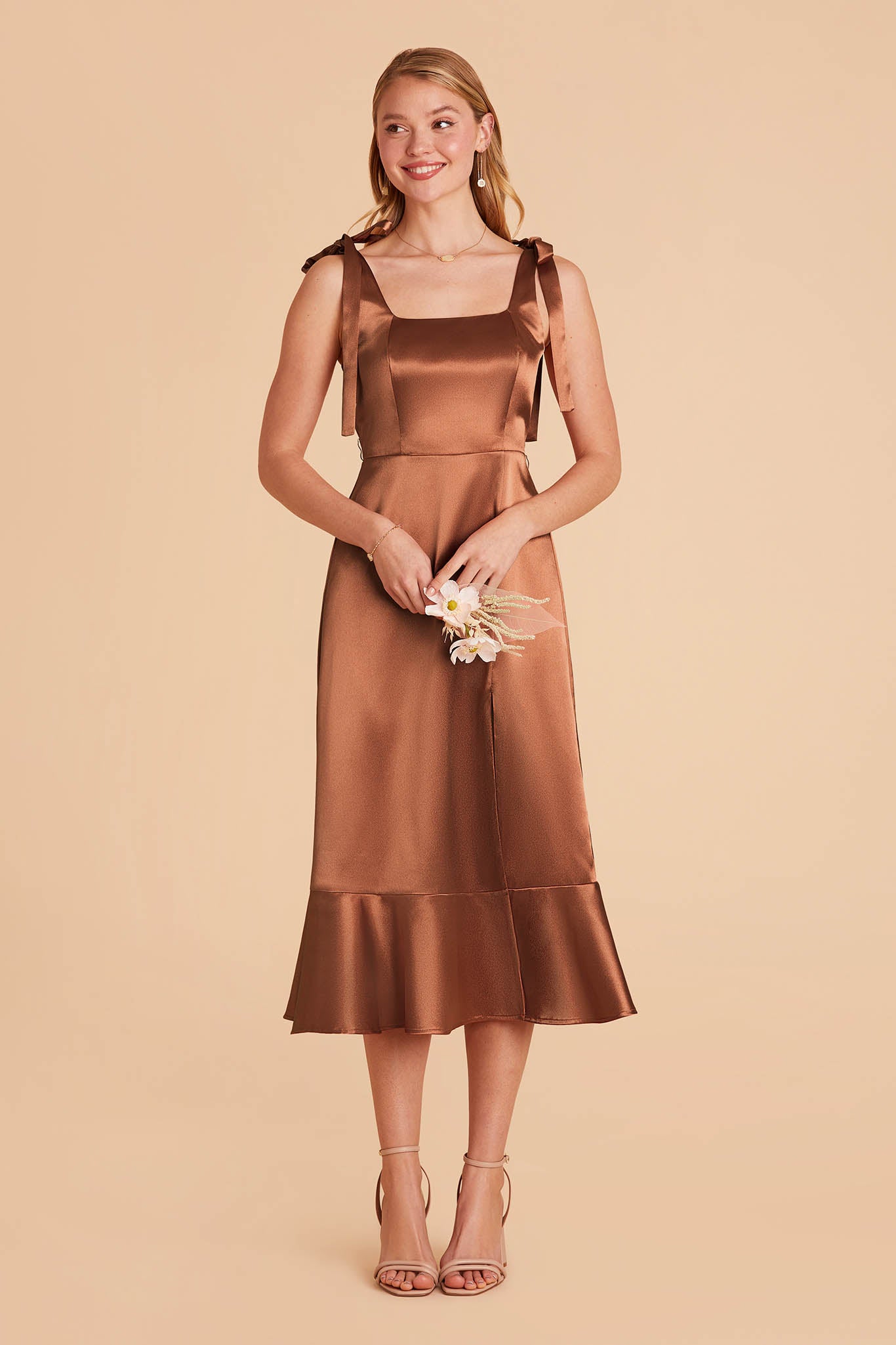rust brown satin convertible pinafore-style midi bridesmaid dress with bows and ruffles