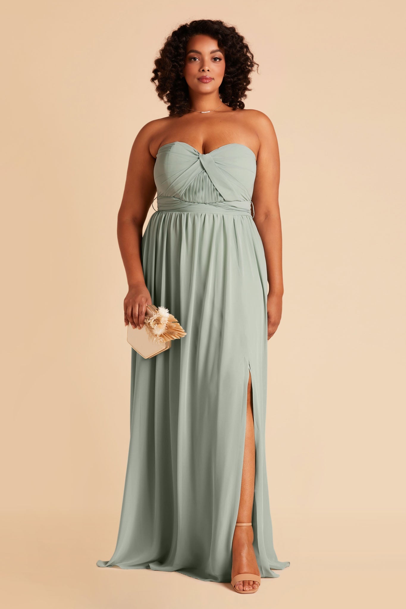 Front view of the floor-length Grace Convertible Plus Size Bridesmaid Dress in sage chiffon paired with the Natalie Chunky Heel by Birdy Grey in nude latte.