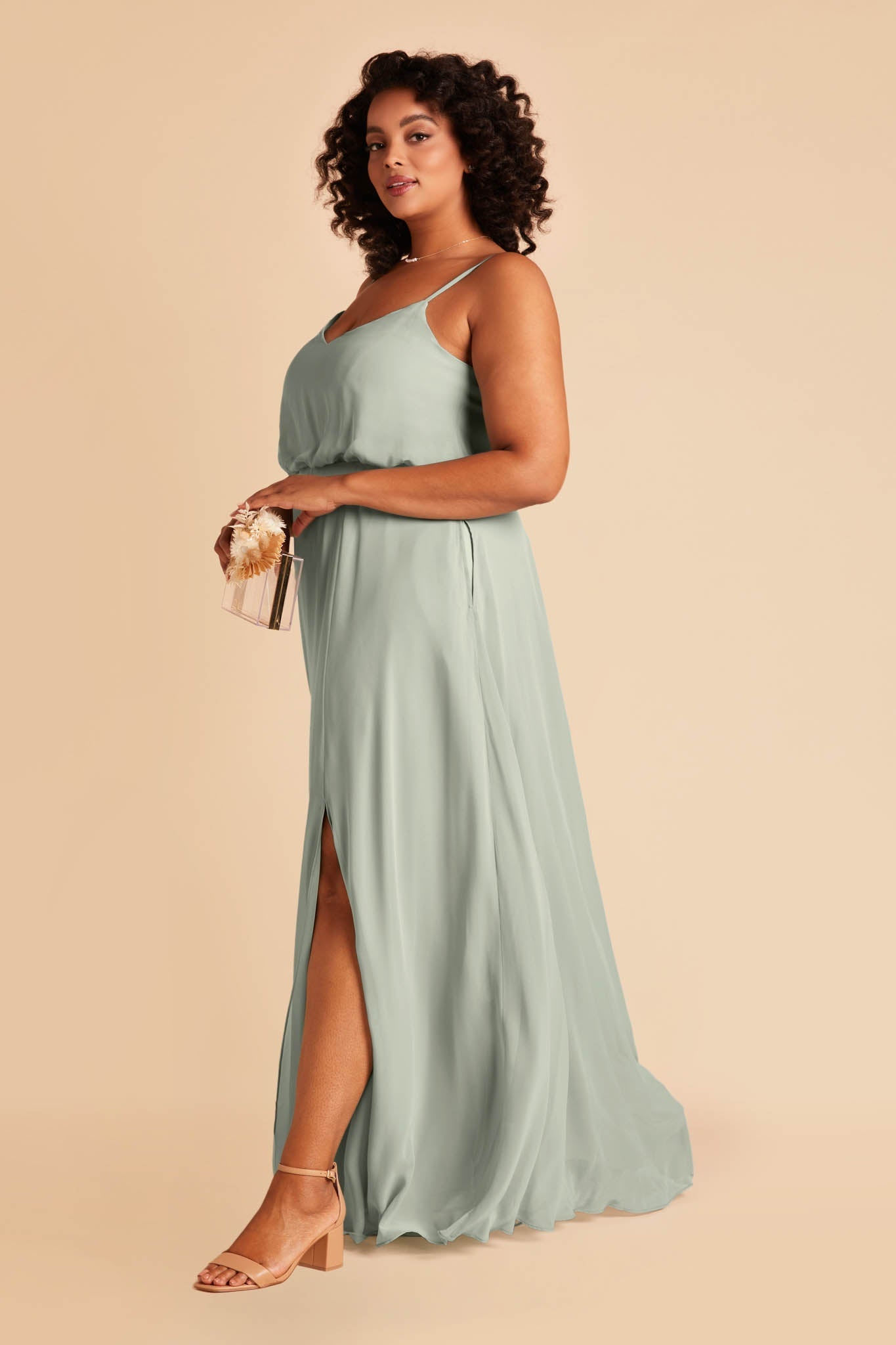 Gwennie plus size bridesmaid dress with slit in sage green chiffon by Birdy Grey, side view