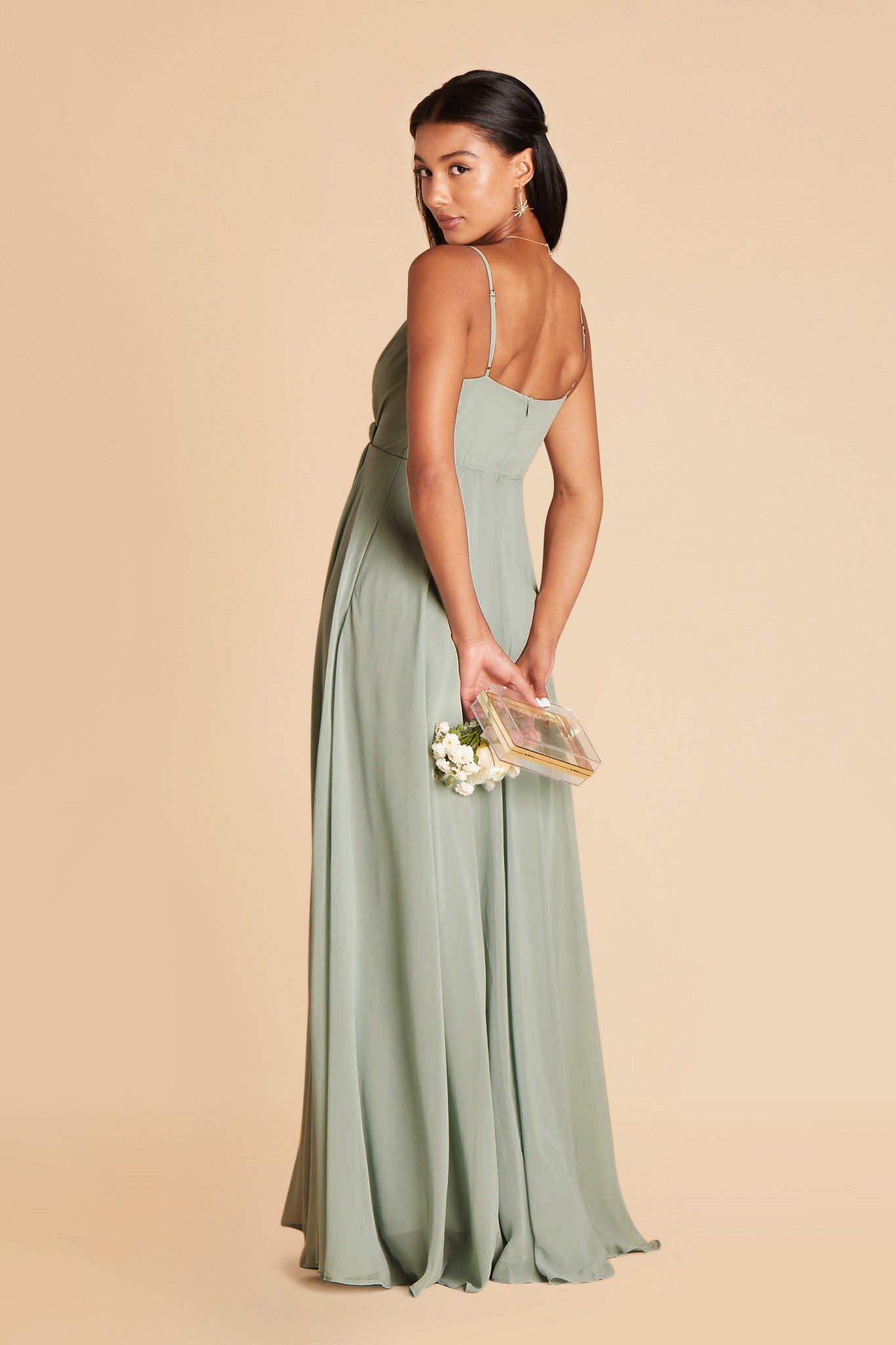 Side and back view of the Kaia Dress in sage chiffon shows a hidden side pocket, adjustable straps, and bodice back with a full length skirt gently gathered at the waist back and flowing to the floor.