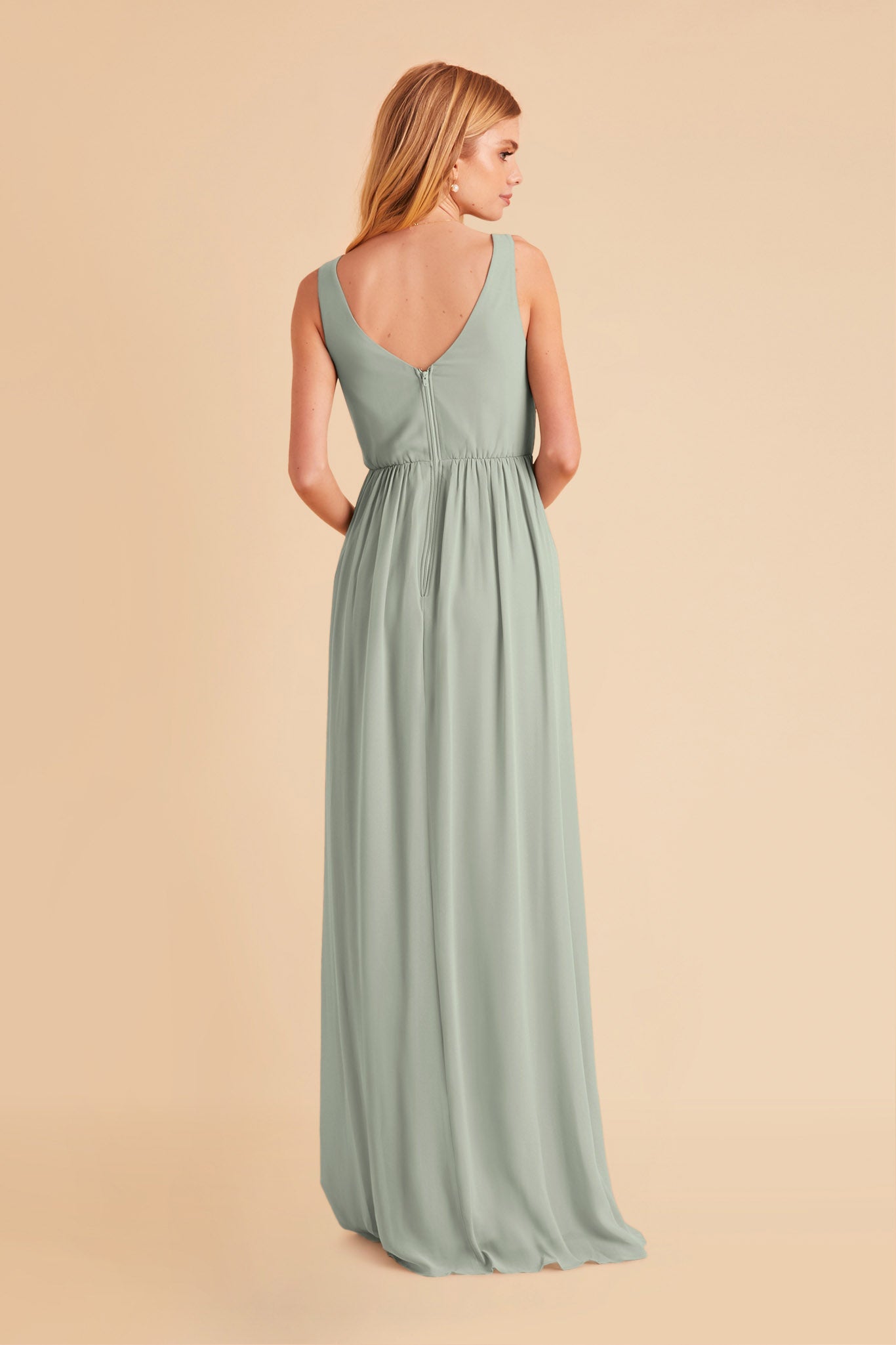 Laurie Empire maternity bridesmaid dress with slit in sage chiffon by Birdy Grey, back view